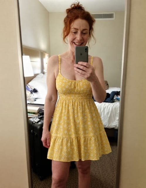 GPT Image 2.5 Flare (high): yellow sundress, mirror selfie framing and hotel room unchanged