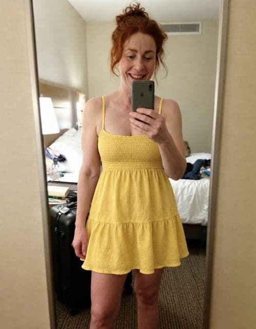 GPT Image 2.5 Flare (medium): yellow sundress, mirror selfie framing and hotel room unchanged