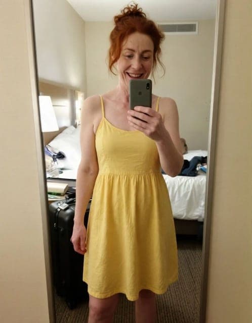 Muse Image: yellow sundress, mirror selfie framing and hotel room unchanged
