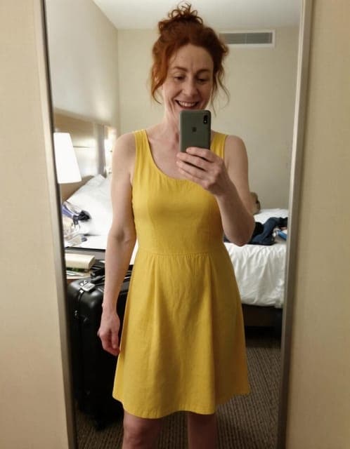 Seedream 5 Pro: yellow sundress, mirror selfie framing and hotel room unchanged